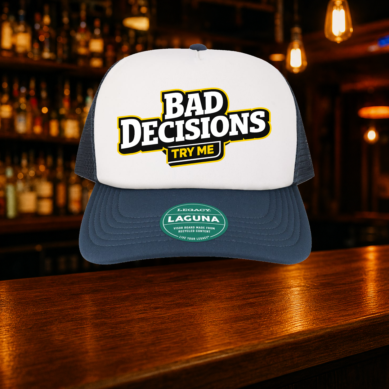 Bad Decisions Try Me Trucker Hat — Navy variety shown against a warm after-dark bar backdrop