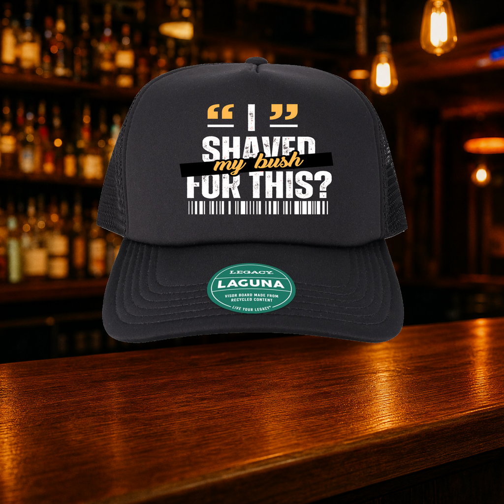 Bush Trucker Hat — All Black variety shown against a warm after-dark bar backdrop