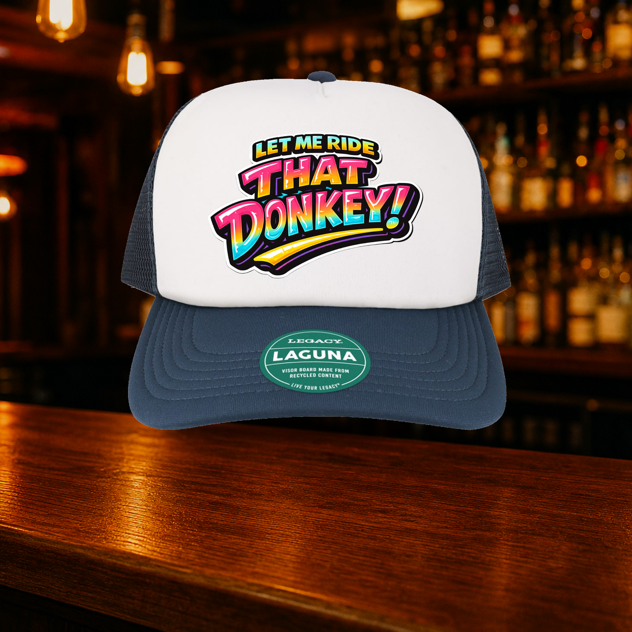 Donkey Trucker Hat — Navy variety shown against a warm after-dark bar backdrop