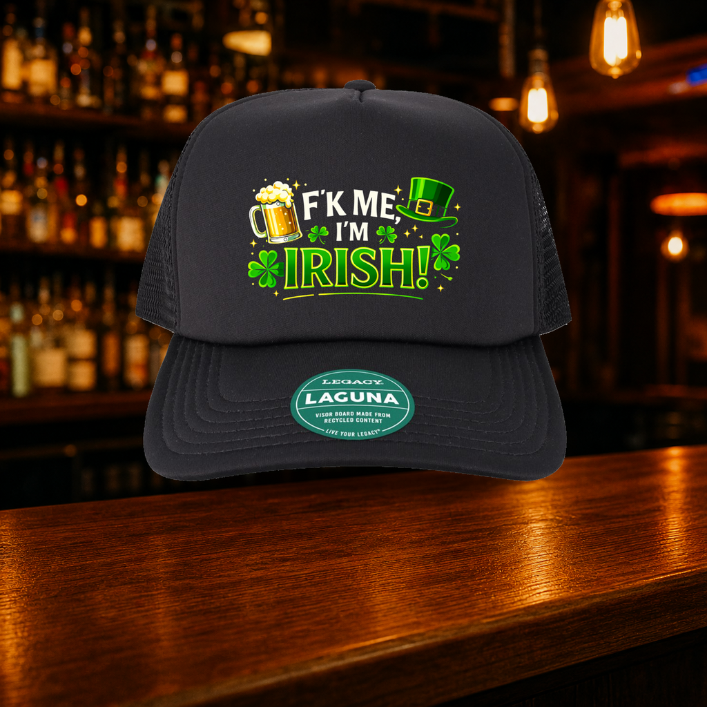 F’ Me I’m Irish Trucker Hat shown against a warm after-dark bar backdrop