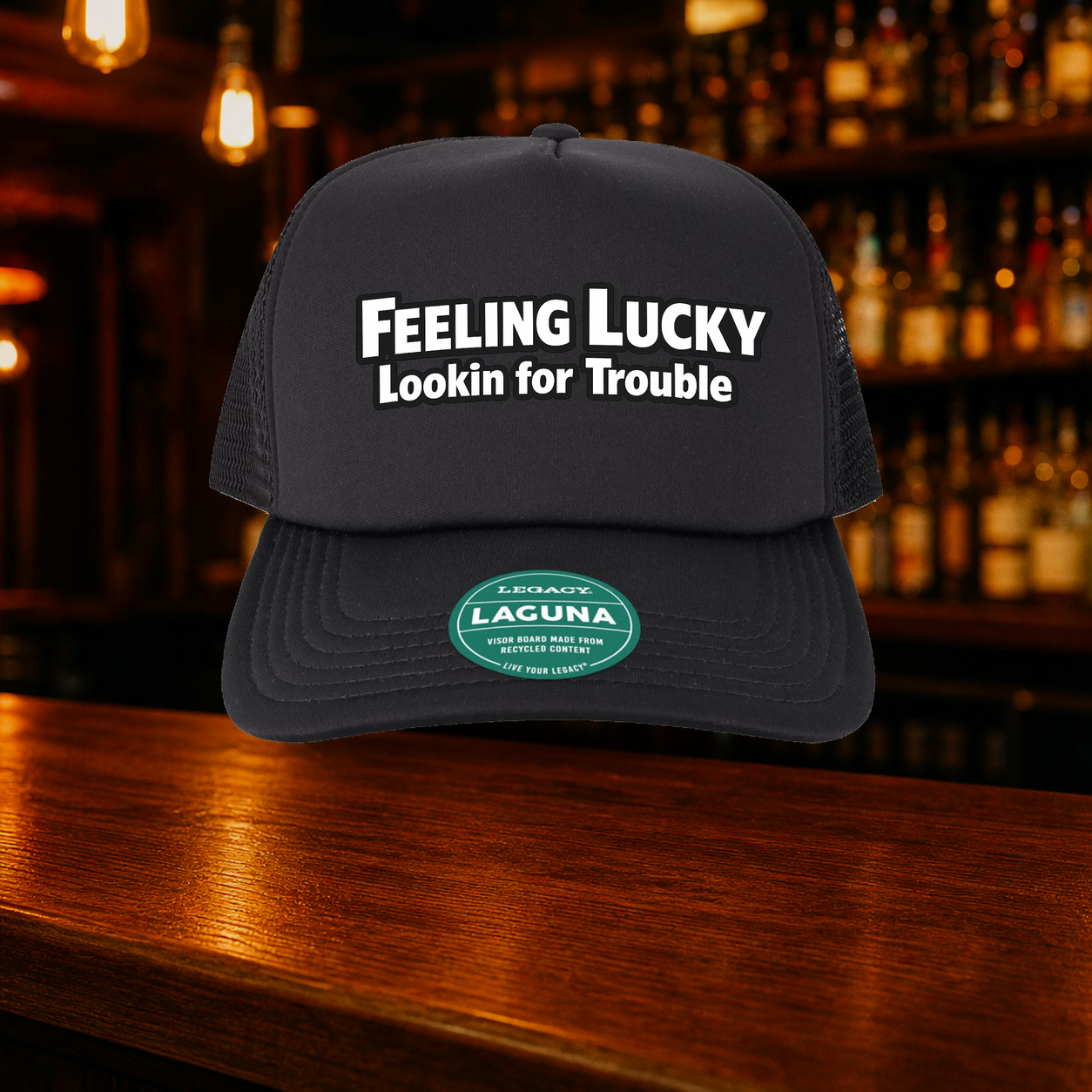 Feeling Lucky Looking for Trouble Trucker Hat — All Black variety shown against a warm after-dark bar backdrop