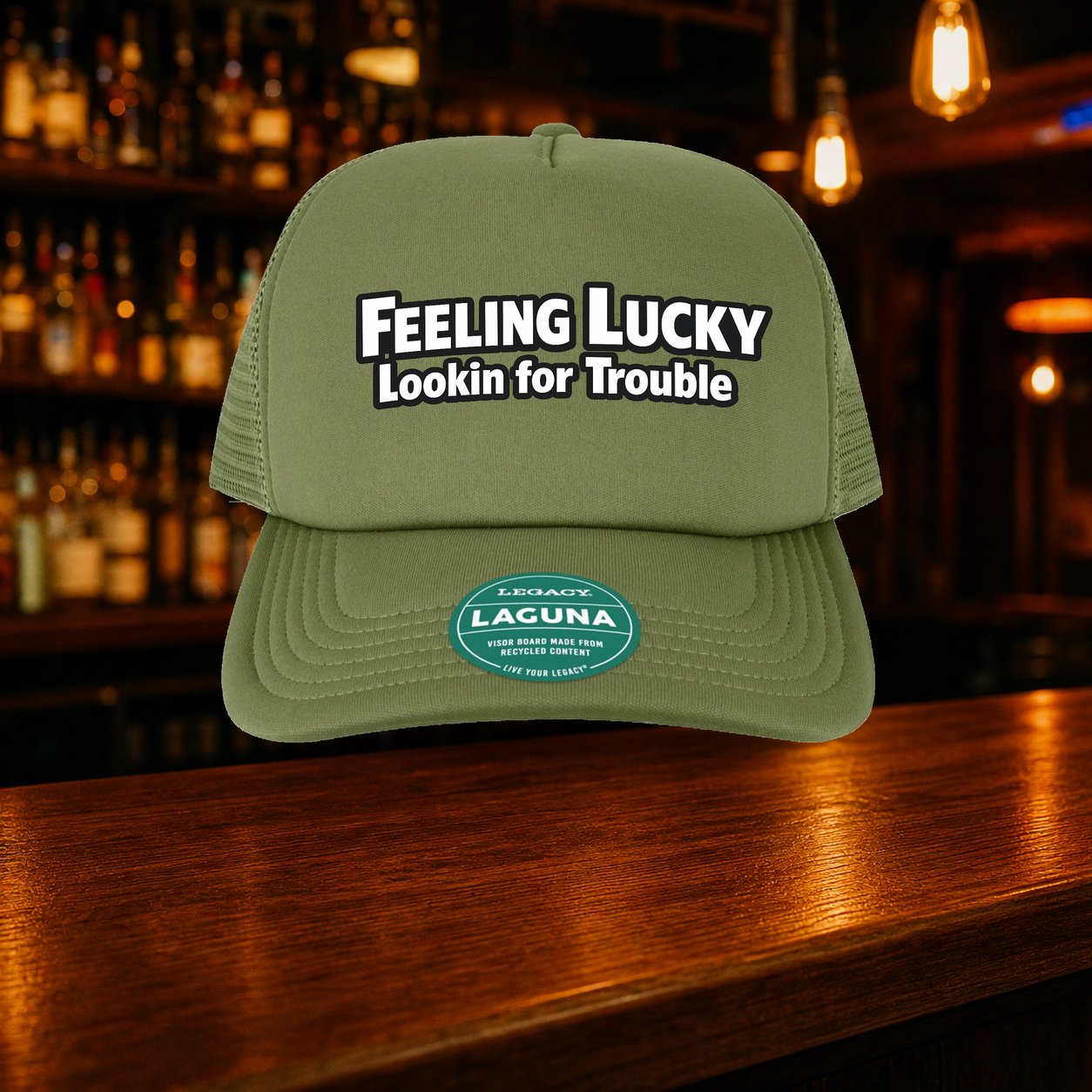 Feeling Lucky Looking for Trouble Trucker Hat — Olive variety shown against a warm after-dark bar backdrop