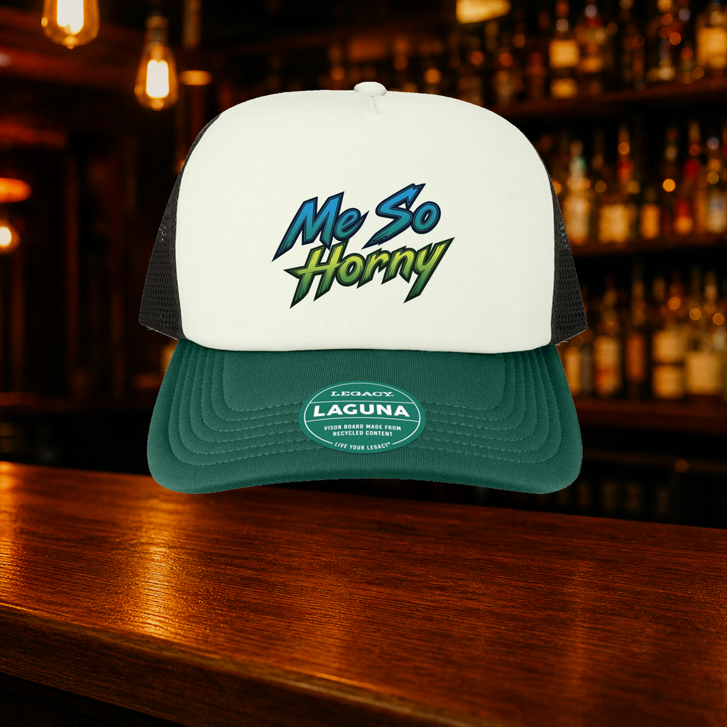 Me So Horny Trucker Hat — Green variety shown against a warm after-dark bar backdrop