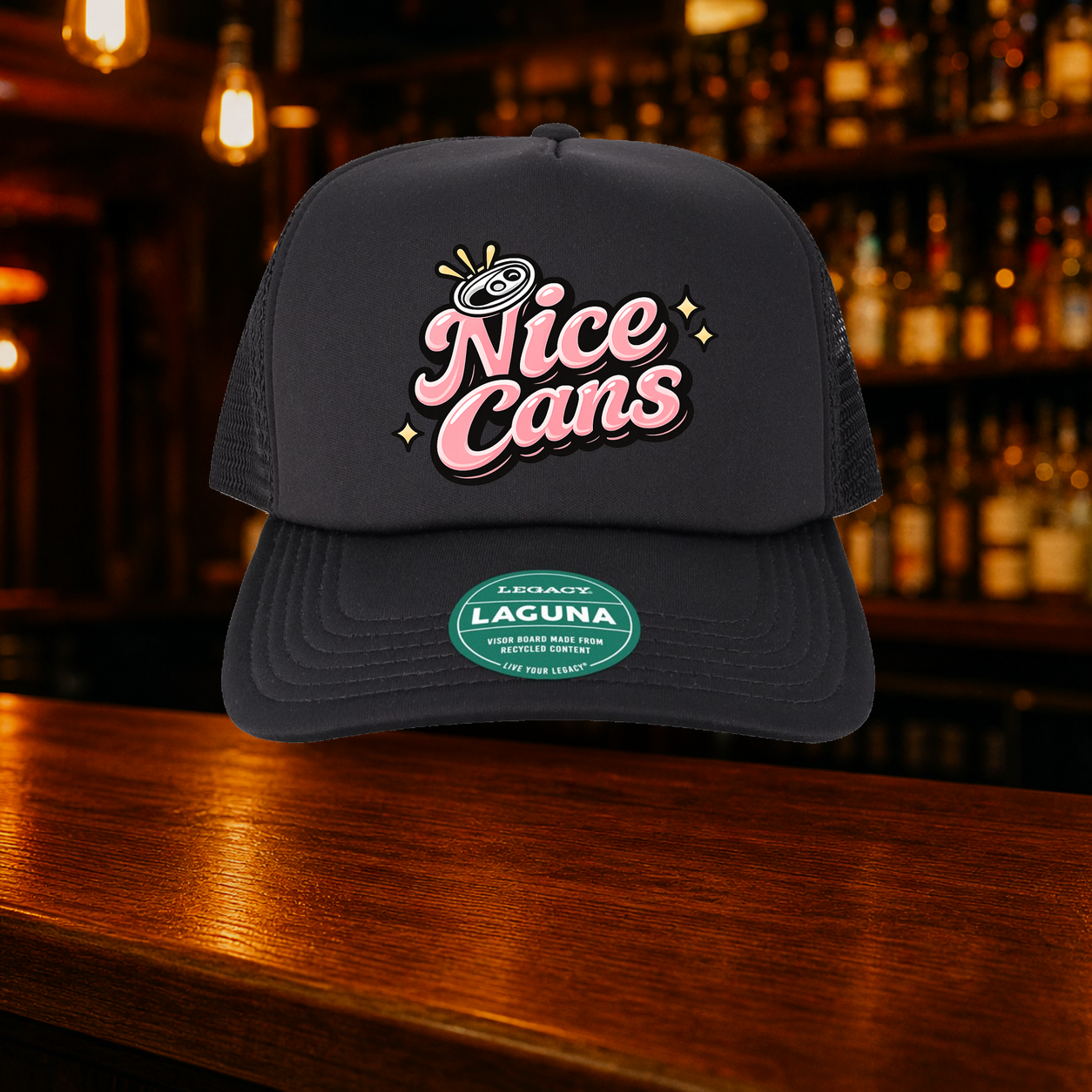 Nice Cans Trucker Hat — All Black variety shown against a warm after-dark bar backdrop