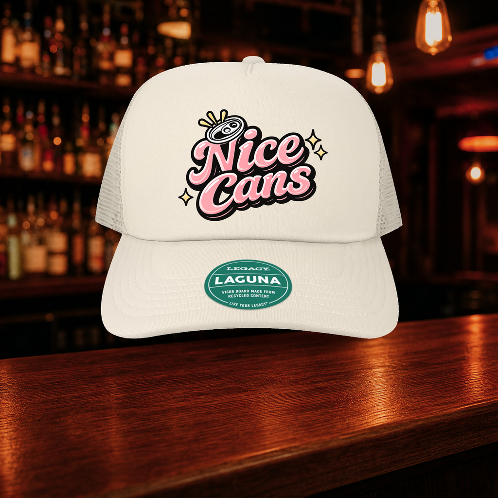 Nice Cans Trucker Hat — Beige variety shown against a warm after-dark bar backdrop