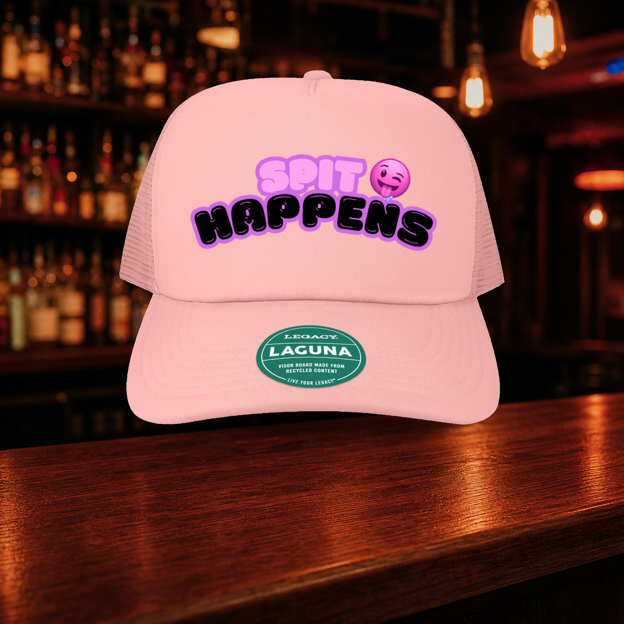 Spit Happens Trucker Hat shown against a warm after-dark bar backdrop
